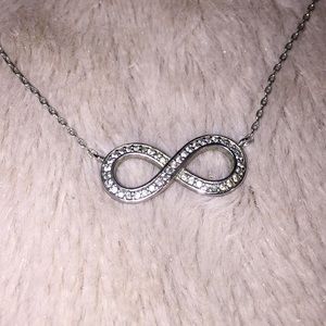 Silver infinity necklace with stones